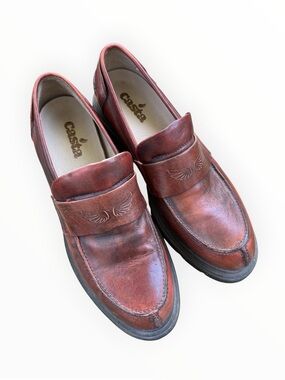 Casta branded loafers featuring a brown leather upper and a chunky platform sole